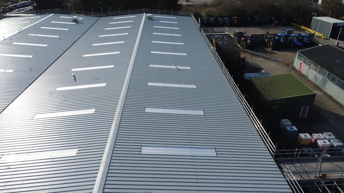 Aerial view of 8,000m² asbestos roof replacement at New Holland Tractor Plant by Anglia Decor